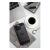 Stylish iPhone 15 carbon case on a desk with coffee and laptop