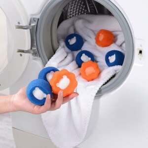 Lint catcher balls for washing machine, blue and orange lint catcher balls in washing machine with white clothes - Laundry Egg