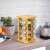 16-piece rotating bamboo spice rack with glass jars in kitchen