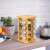 16-piece rotating bamboo spice rack with glass jars in kitchen