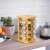 16-piece rotating bamboo spice rack with glass jars in kitchen