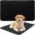 Black quilted dog pee pad with a dog lying on it