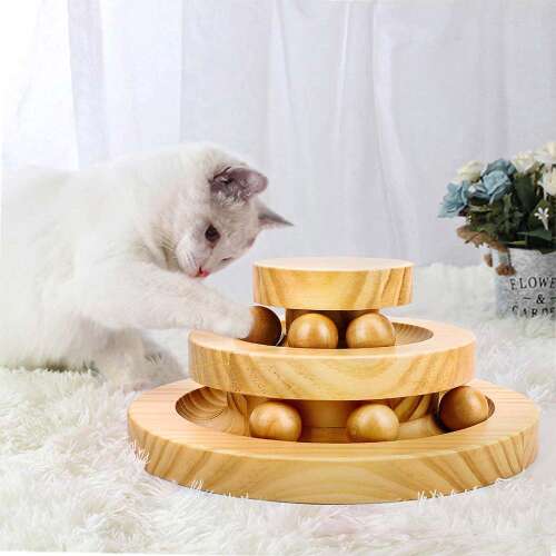 Cat playing with wooden rolling ball toy, interactive cat toy, cat exercise toy