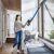 Woman using Bissell Icon Turbo cordless vacuum cleaner to clean window frame