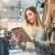 Woman using tablet in clothing store