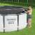Woman installing Bestway 305cm Pool Cover on Steel Pro MAX Pool