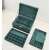 Green jewelry box with compartments for necklaces, earrings, rings, and bracelets