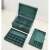 Green jewelry box with compartments for necklaces, earrings, rings, and bracelets