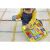 Baby playing with Fisher-Price Laugh & Learn Puppy's Activity Board on rug
