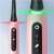 Oral-B iO Series 5 electric toothbrush, pink, with green and red light indicators