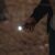 NEBO Newton 500 flashlight in use, outdoor, dark