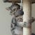 Cat scratching sisal post on Purlov cat tree