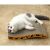 Cat resting on Purlov Cat Wave cardboard scratcher