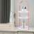 Mercaton® 3-tier round cosmetic organizer with handle, pink, on a white vanity table