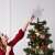 Silver star Christmas tree topper on a Christmas tree