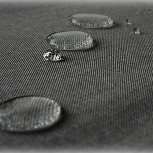 Close-up of Jemidi grey tablecloth with water droplets, showcasing lotus effect
