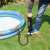 Person using Bestway Air Hammer foot pump to inflate an inflatable pool