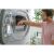 Man emptying lint filter of Candy RapidÓ PRO heat pump dryer