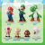 Super Mario character figurines: Mario, Luigi, Yoshi, Toad, Goomba, Boo