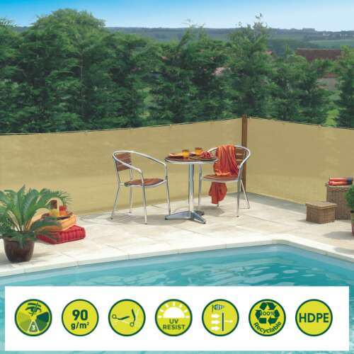 Sand colored shade net for privacy and sun protection, installed on a fence near a pool, with a table and chairs in the foreground