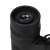 Close-up of the lens of Dörr Sports 8x21 binoculars, black