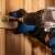 Blaupunkt BP6310AC cordless drill in use, screwing a screw into wood