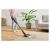 Woman using Sencor SVC 7315TI Cordless Stick Vacuum Cleaner on Carpet
