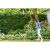 Woman using Bosch EasyGrassCut 23 cordless grass trimmer in garden