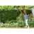 Woman using Bosch EasyGrassCut 23 Corded Grass Trimmer in garden