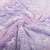 Close-up of the purple glow in the dark unicorn and stars blanket, showing the soft texture