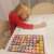 Child using Kruzzel 60 piece stamp set for kids with animals and smiley faces