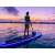Nő eveződesik egy FunWater Smiling Face felfújható SUP deszkán naplementekor