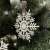 Close-up of Ruhhy Snowflake Christmas Tree Ornament on Tree