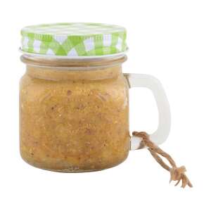 Mogyoróvaj madáreleség üveg bögrében, zöld kockás tetővel és füllel - Madáreleség